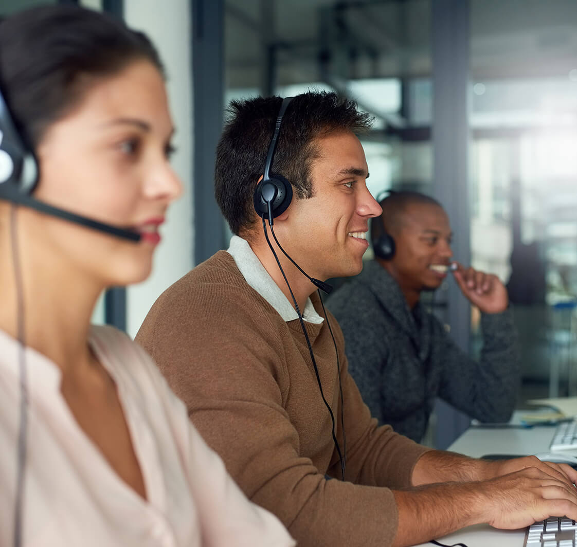 Shot of call centre agents working in an office.