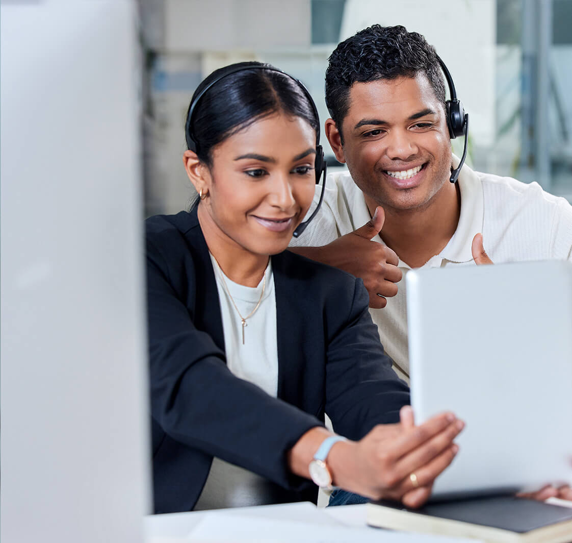 Man and woman speaking on headsets