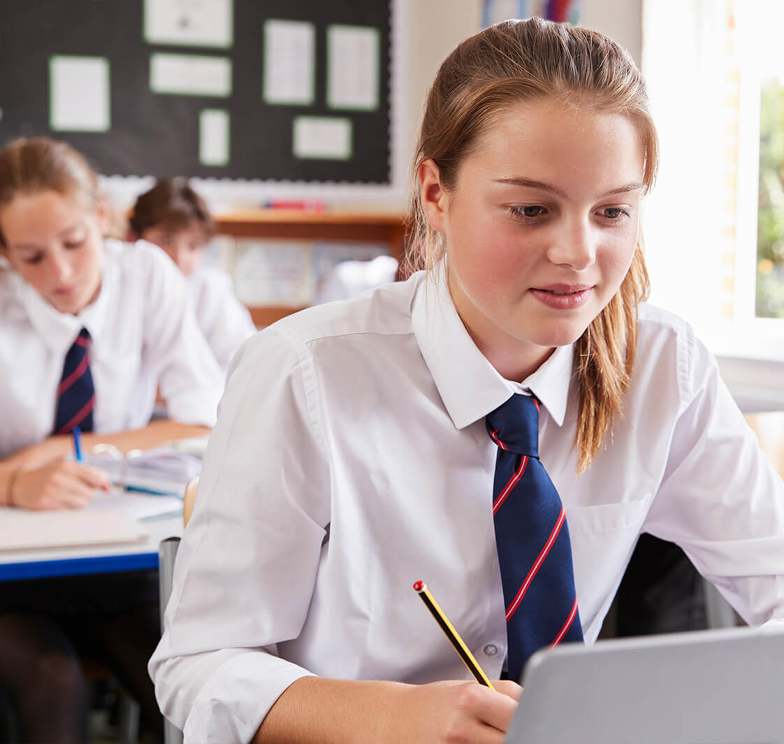 Children in a classroom using computers.