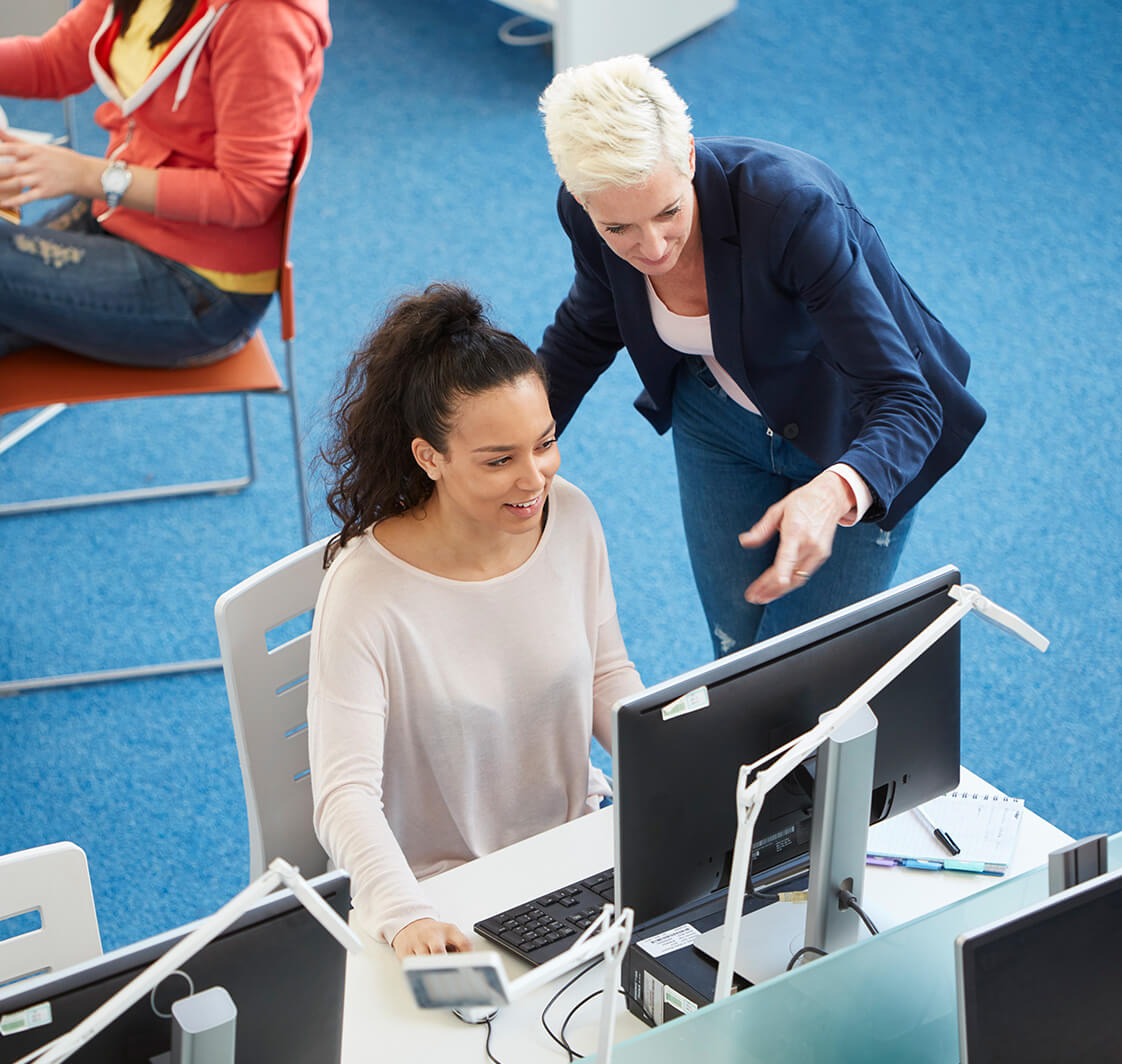 People in a university library using computers.