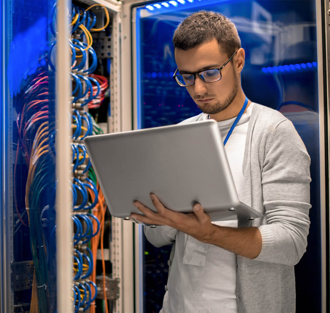 It technician working in a server room.