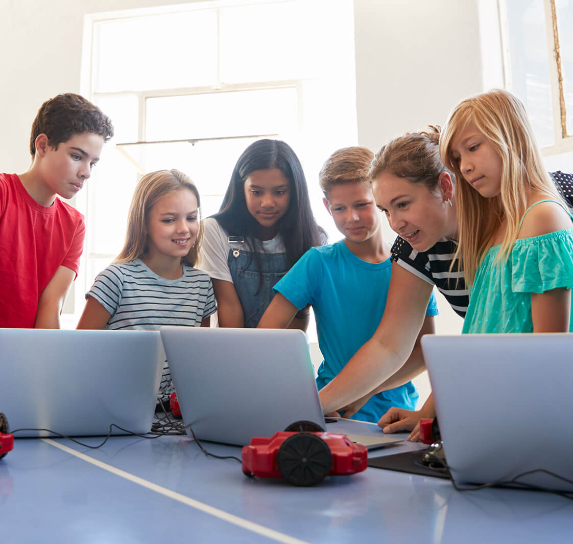 Children using IT in a school classroom.