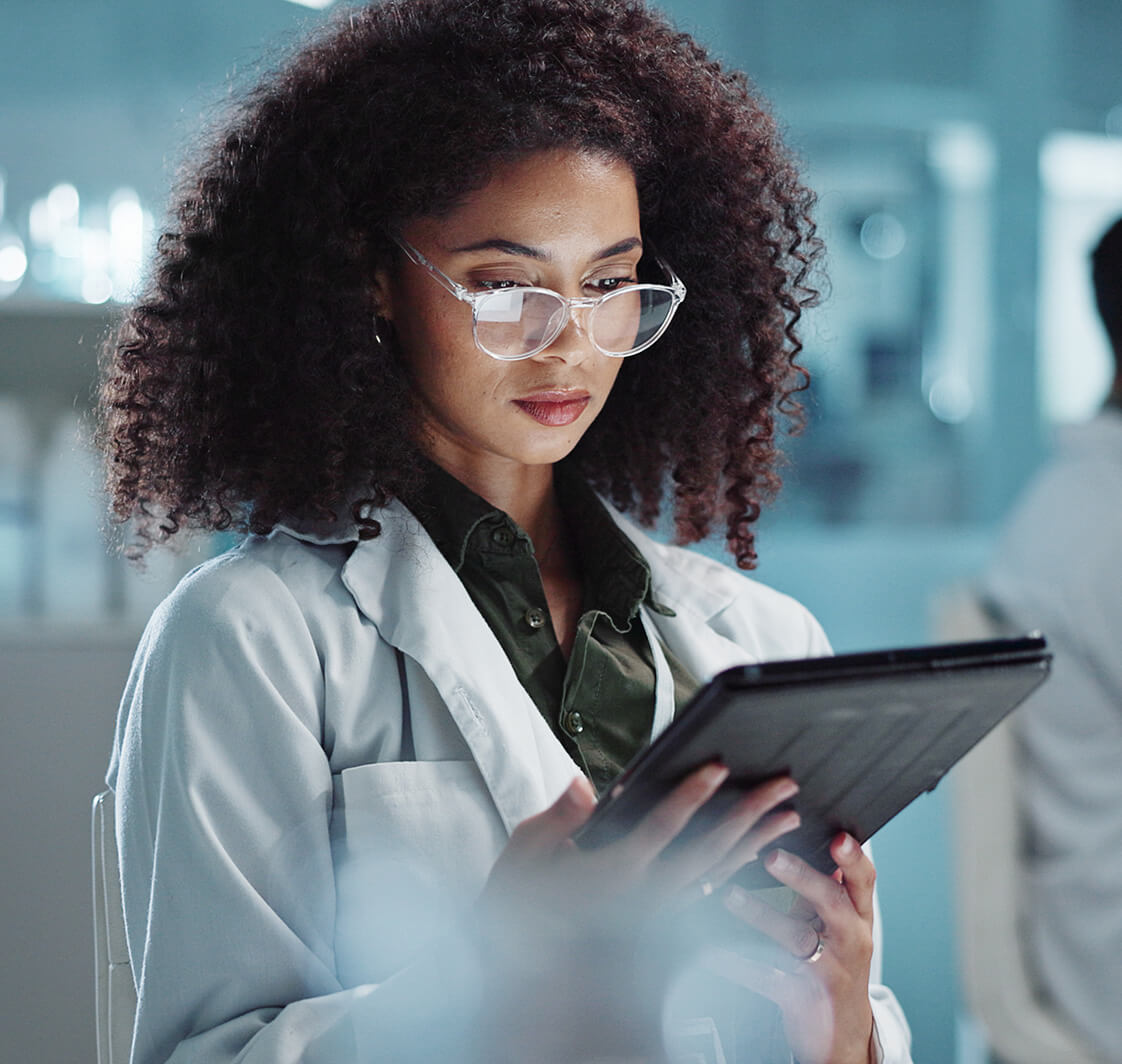 Tablet, reading and woman scientist in laboratory working on medical research, project or experiment.