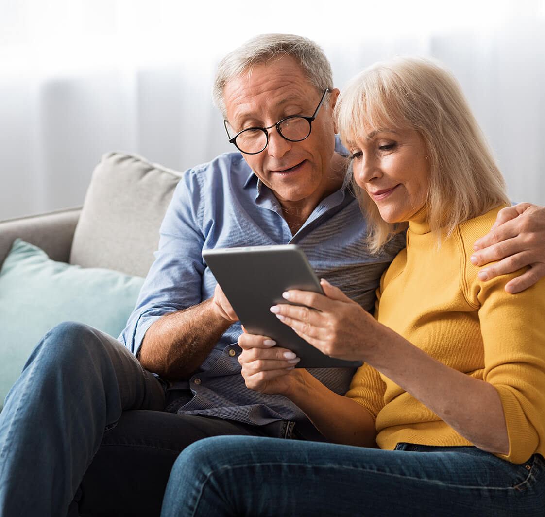 Older couple using a tablet