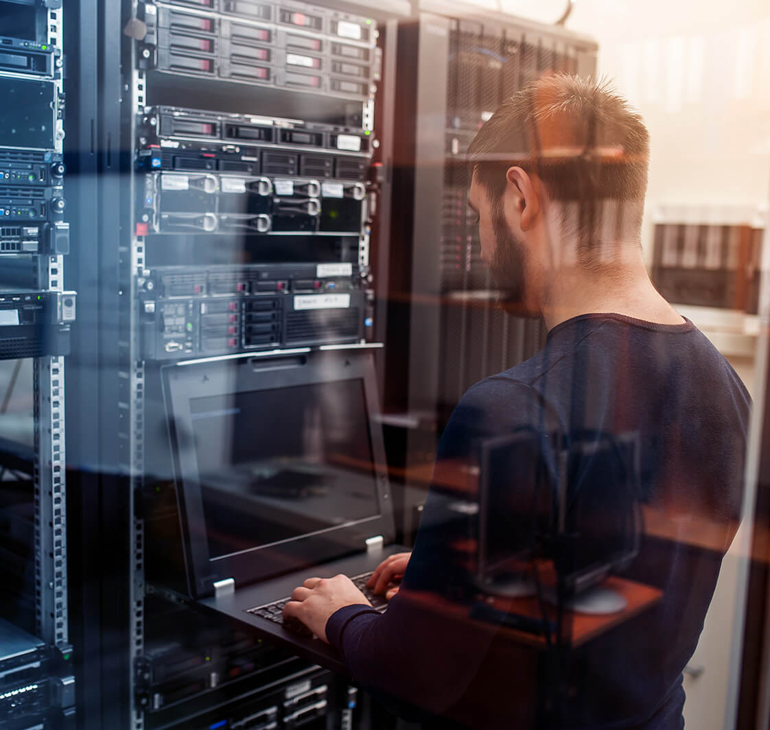 Network engineer working in a server room