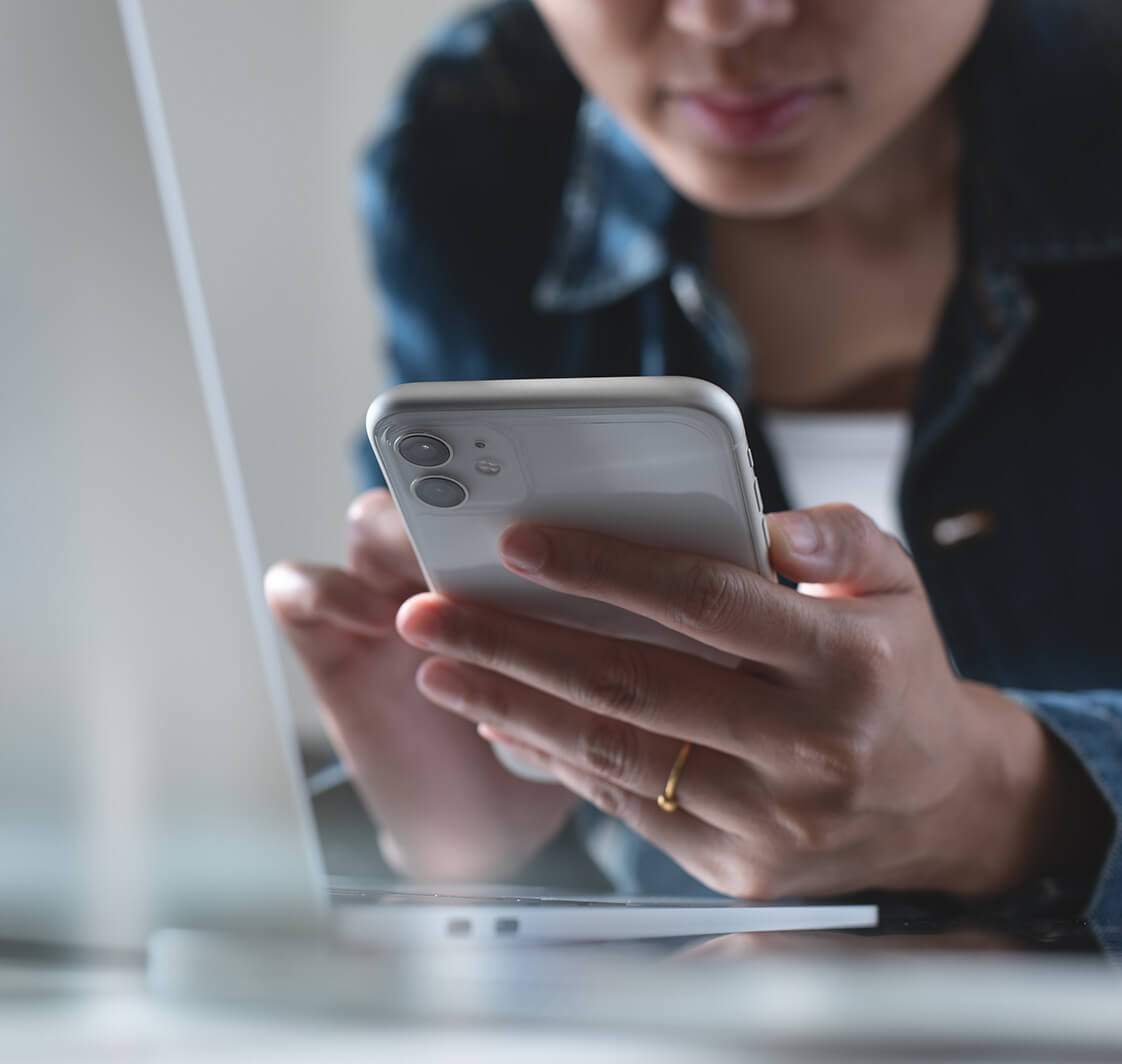 Woman using mobile phone.