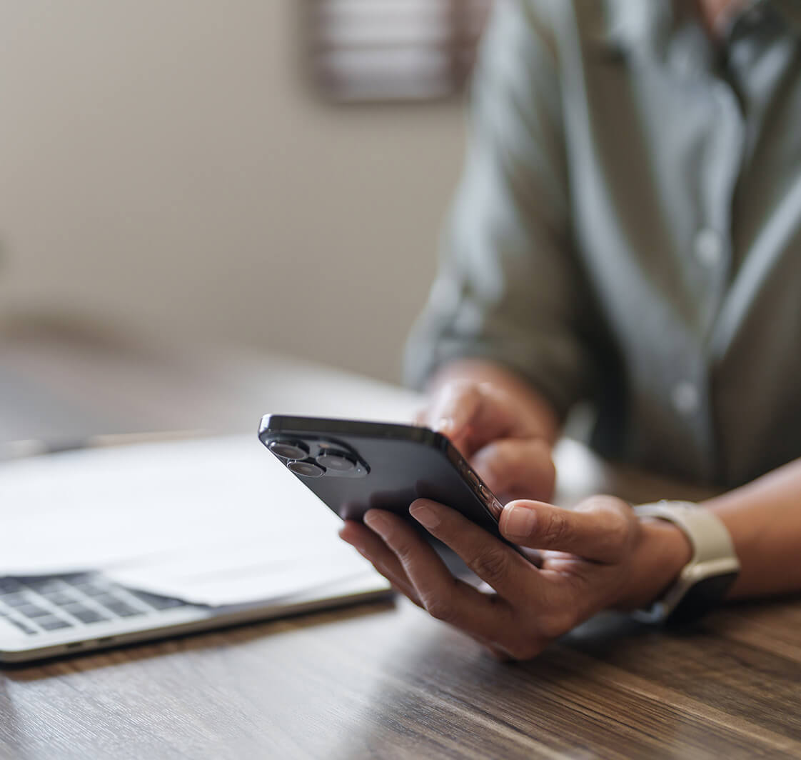 Woman using mobile phone.