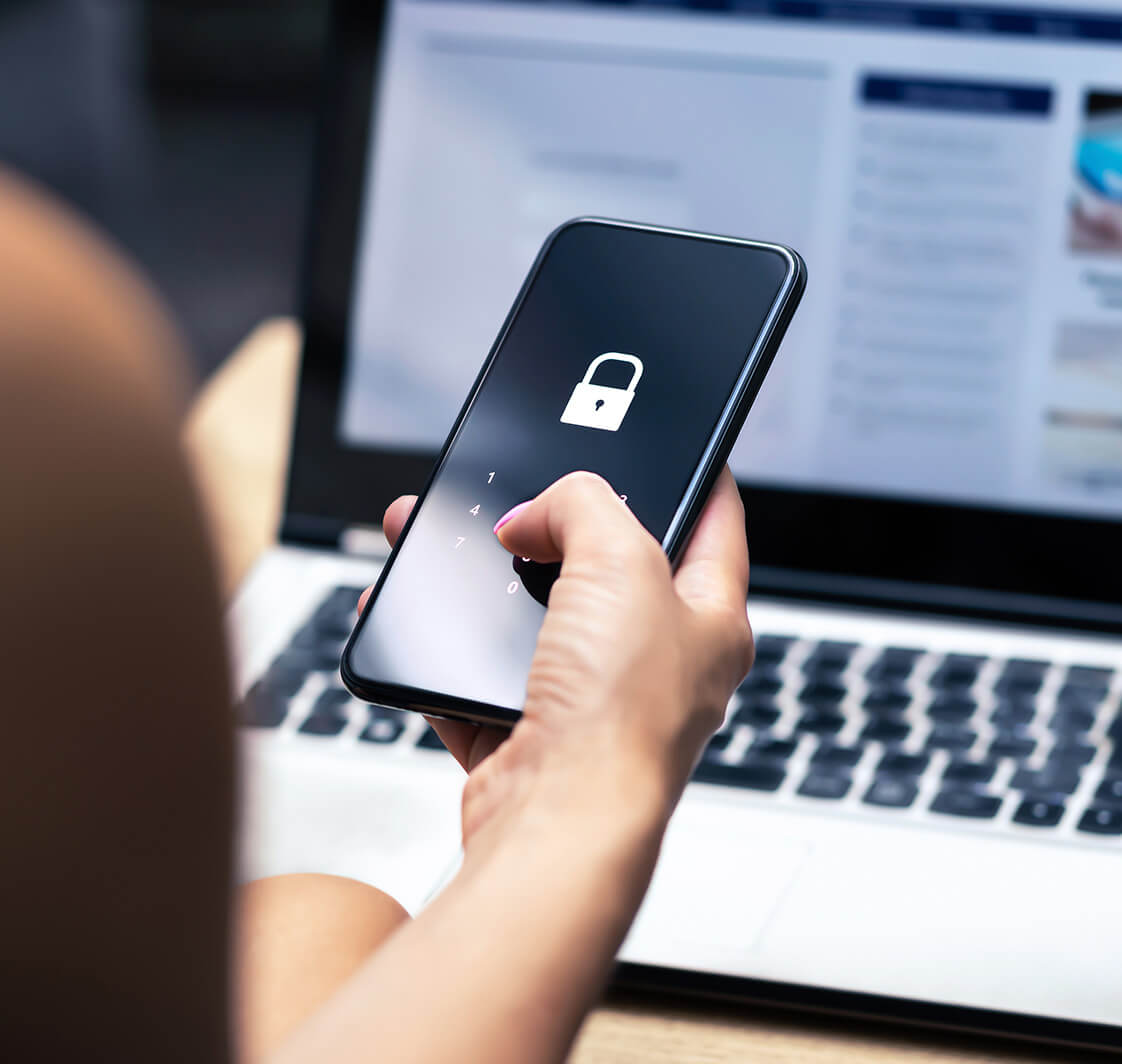 Phishing, mobile phone hacker or cyber scam concept. Password and login pass code in smartphone. Online security threat and fraud. Female scammer with cellphone and laptop. Bank account security