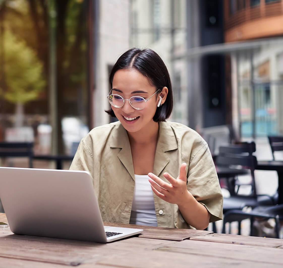 Woman using a laptop outdoors.