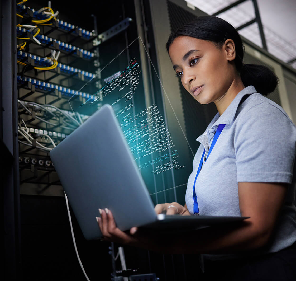 Laptop, network and data center with a black woman it support engineer working in a dark server room. Computer, cybersecurity and analytics with a female programmer problem solving or troubleshooting.