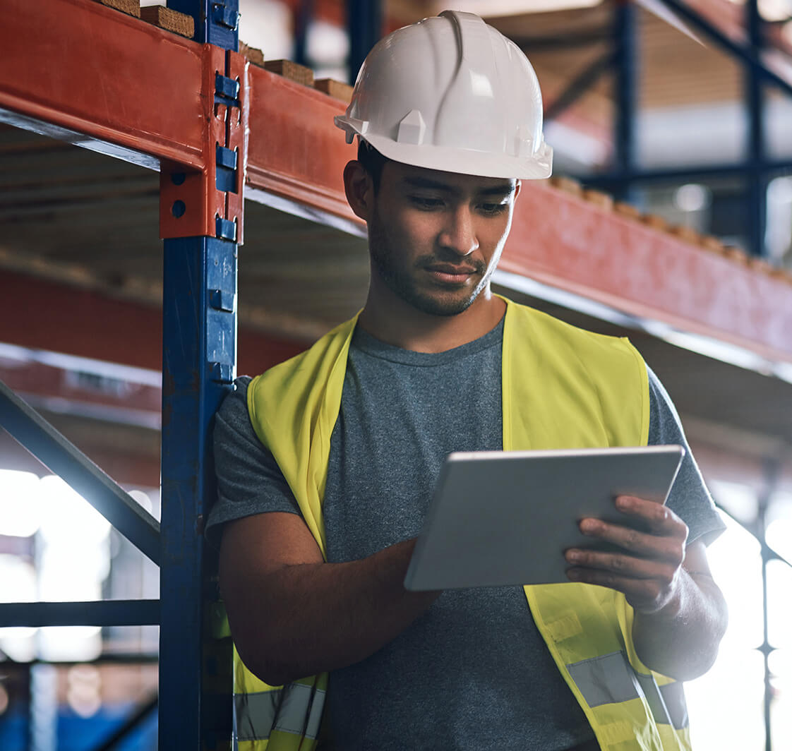 Get all the info where and when you need it. Shot of a builder using a digital tablet while working at a construction site.