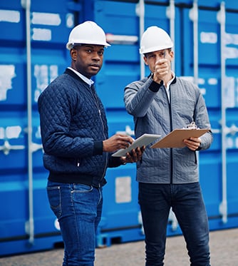 Men in hard hats discussing.