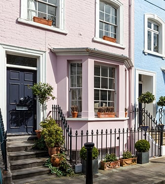 London street of terraced houses without parked cars.