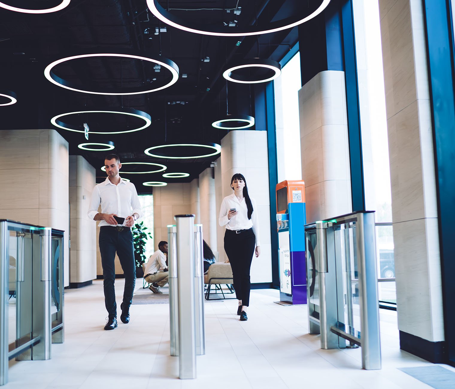Wavenet-Connected-flexpace-workspaces-Confident coworkers passing checkpoint at workplace
