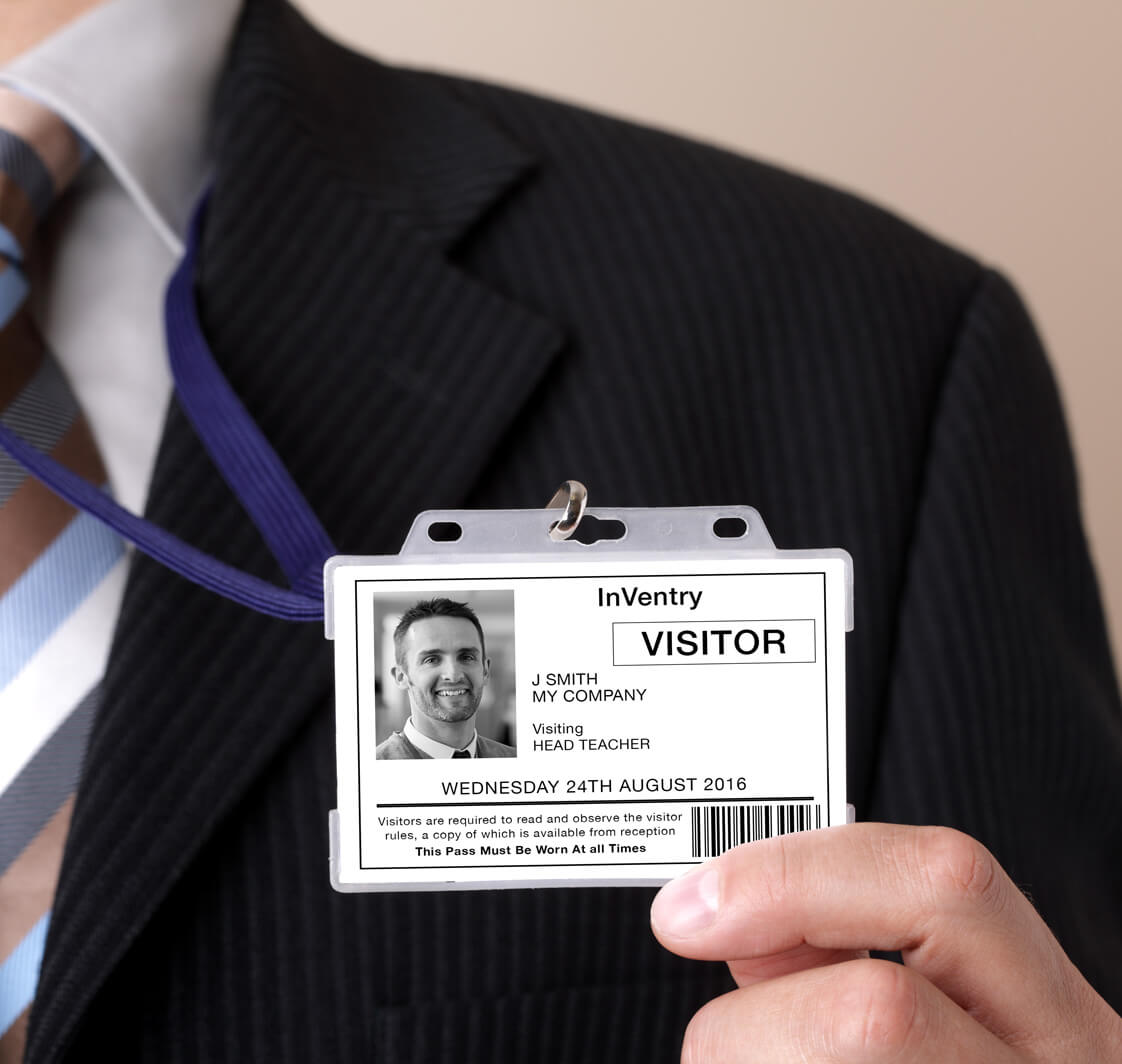 Man holding up ID card.