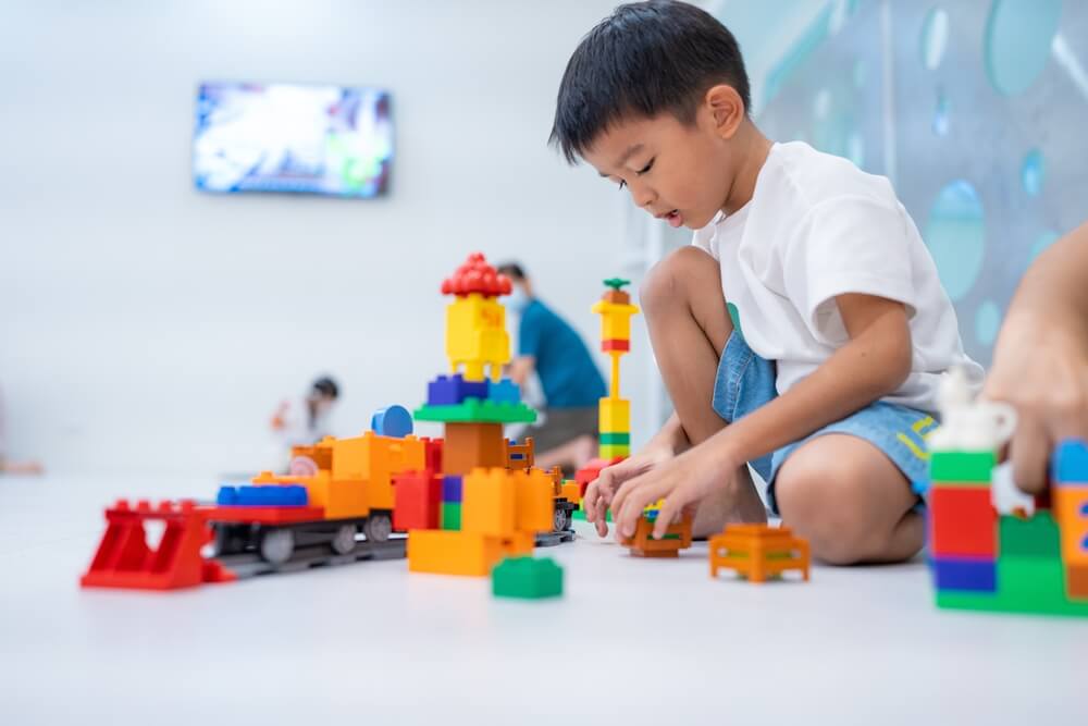 Kid playing with toys from The Entertainer toy shop