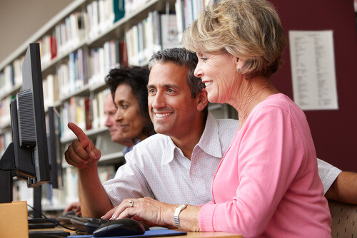 People of all ages using the Wi-Fi in Manchester City public libraries