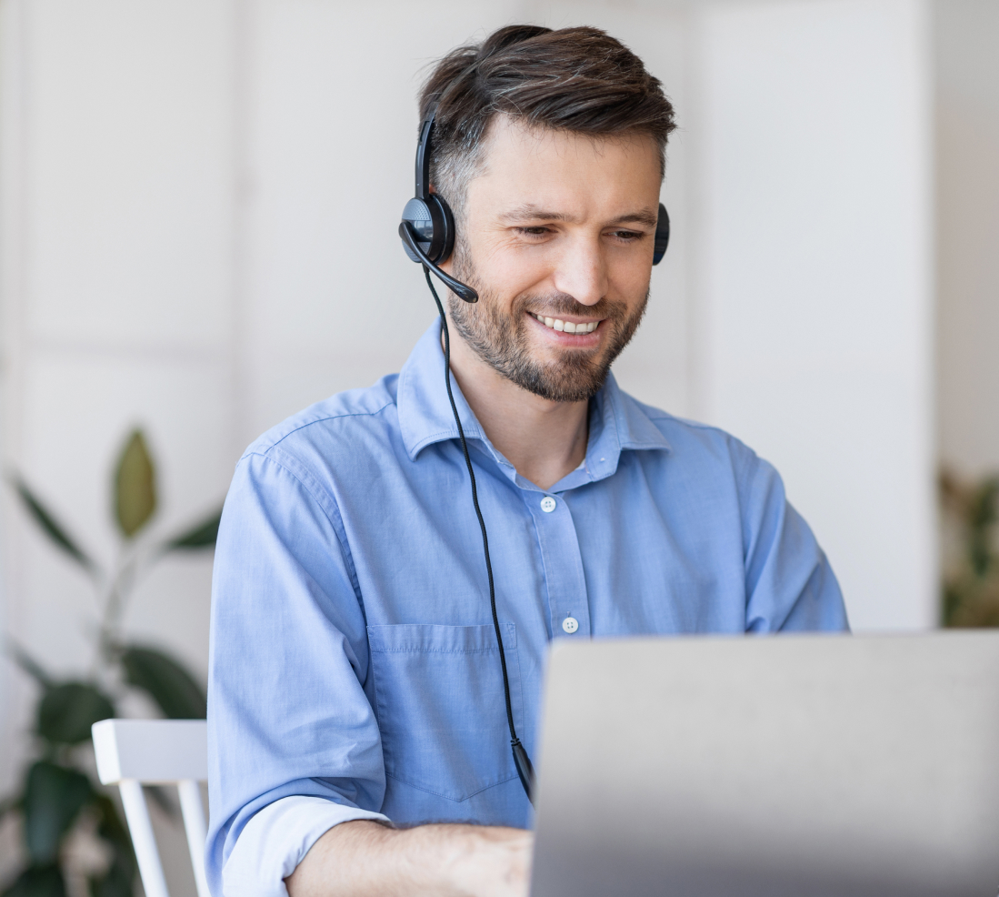 man in shirt with headset working at call centre