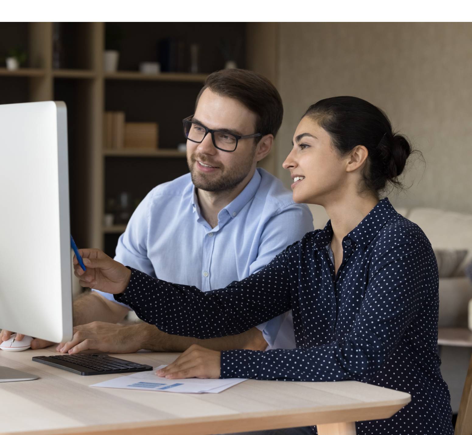 Man and woman looking at computer