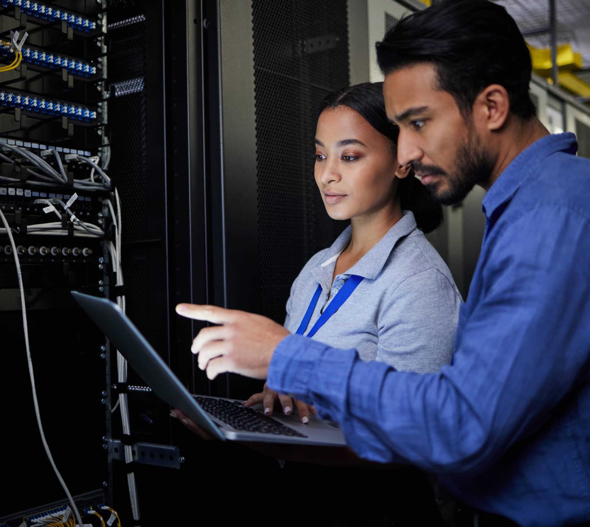 Two colleagues checking server health