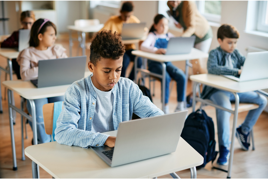 Students using Microsoft 365 on laptops